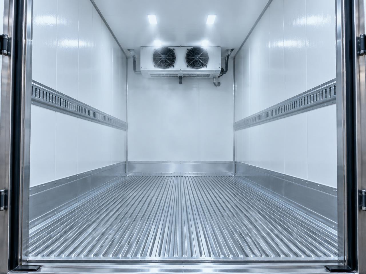 Clean insulated truck interior with the refrigeration cooling unit on the front wall