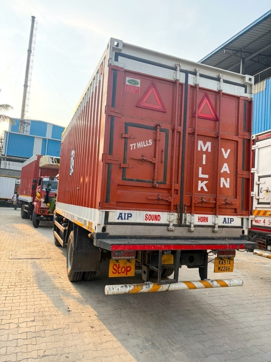 Milk van container truck parked at a logistics yard
